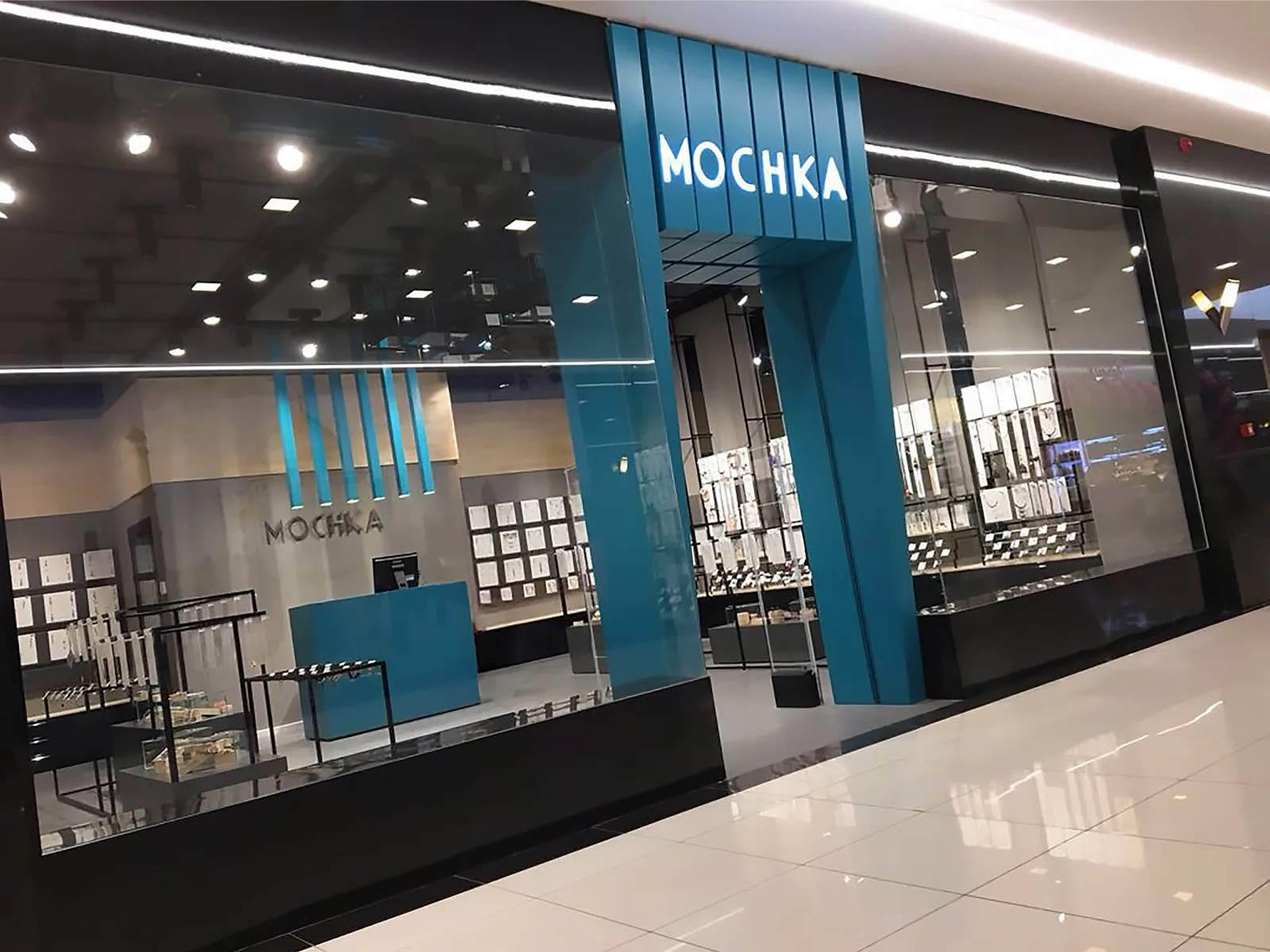 Mochka jewellery store — a teal-framed shopfront and display hall inside a shopping centre