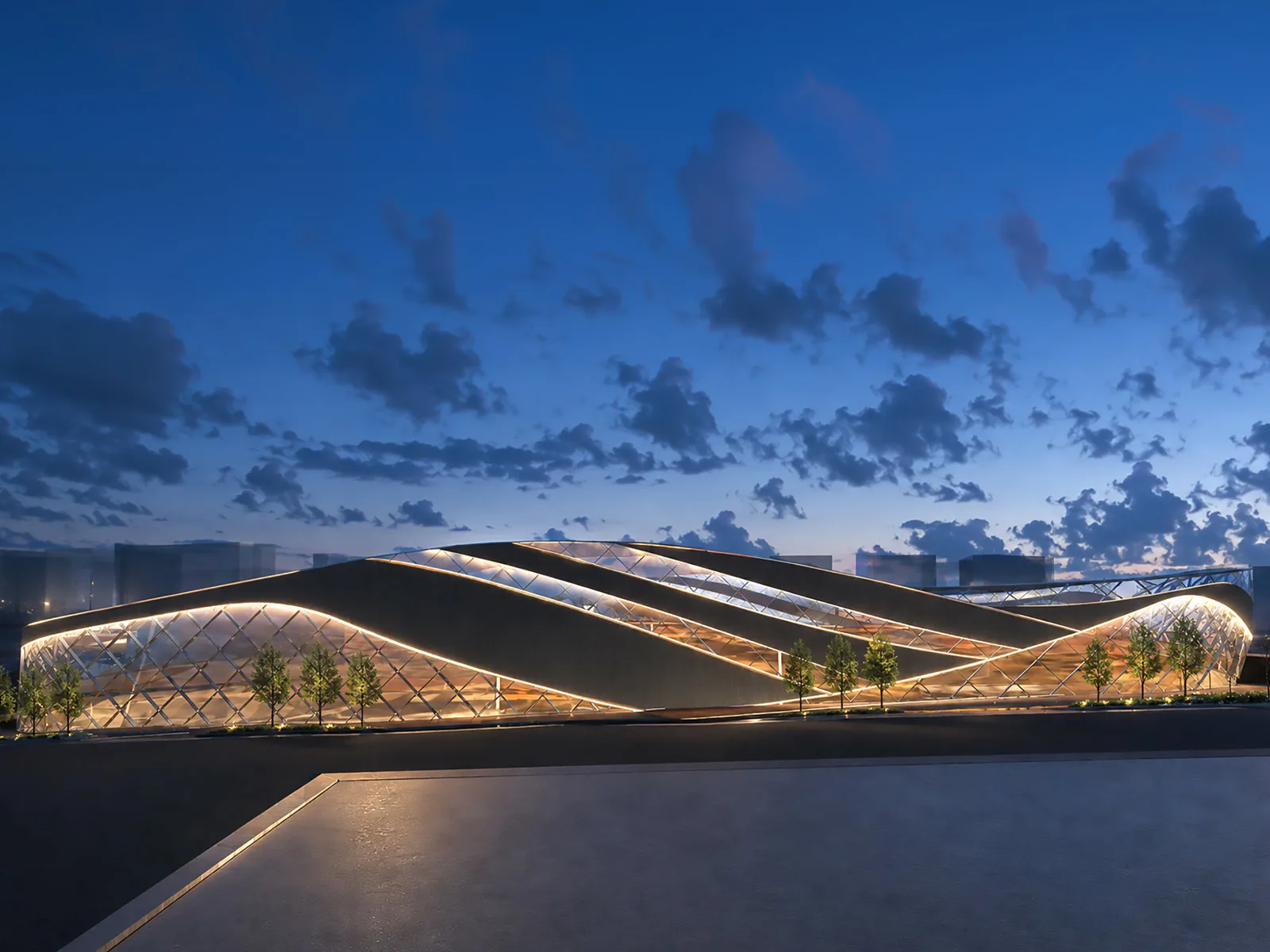 Yenimahalle Municipal Sports Centre at dusk — a low building under a woven, lit diagrid roof